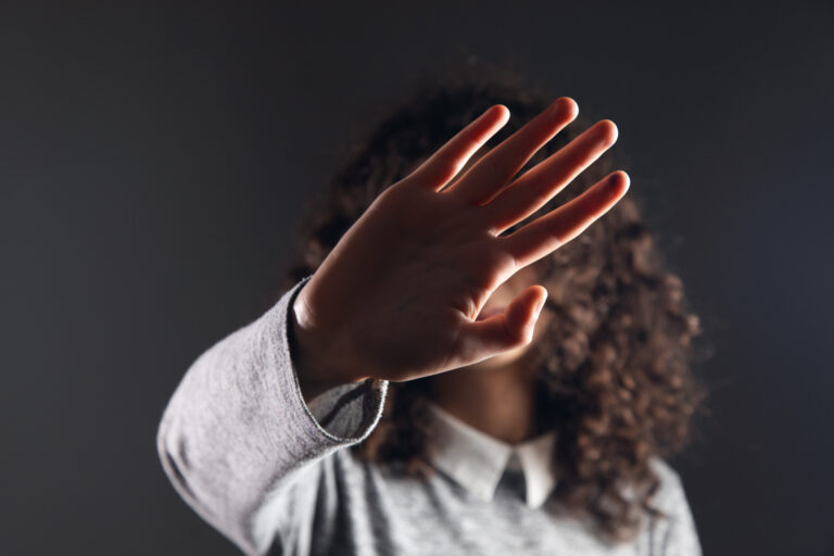 a woman showing stop gesture